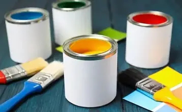 cans of paint on a shelf